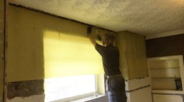 Penetrating damp treatment - applying waterproofing membrane